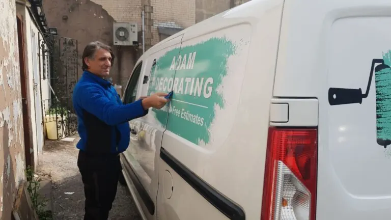 Fitting: Vinyl graphics applied to a van panel by hand