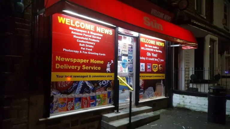 Welcome News: Illuminated fascia sign and printed window graphics