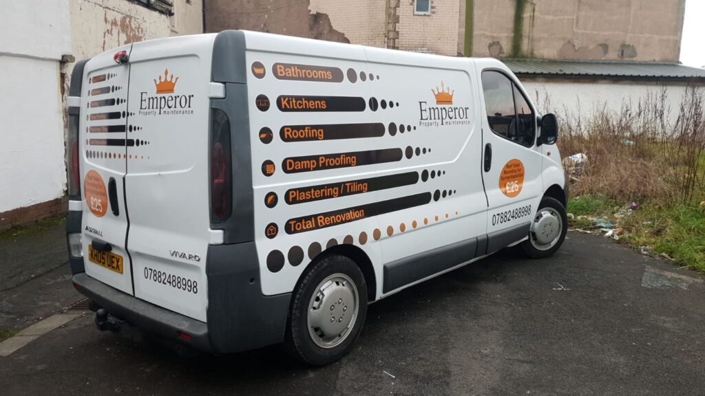 Emperor van with printed side graphics, photographed on the road
