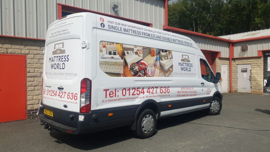 Mattress World van with printed product images along the full side panel