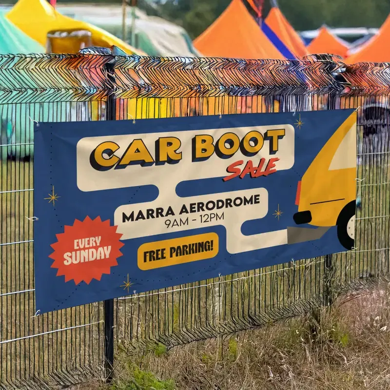 8ft x 3ft PVC Banner: printed car boot sale banner on a fence at an event
