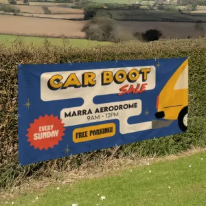 6ft x 3ft PVC Banner: printed car boot sale banner on a hedge by a field
