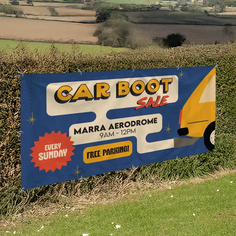 6ft x 3ft PVC Banner: printed car boot sale banner on a hedge by a field