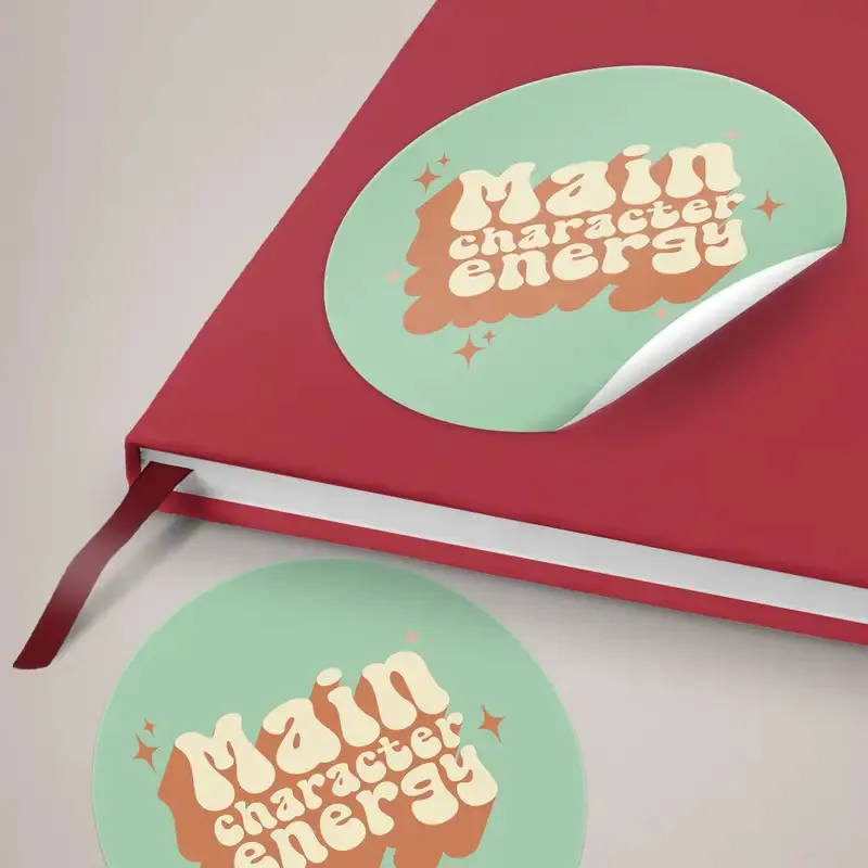 Round Vinyl Stickers: printed round stickers on a notebook